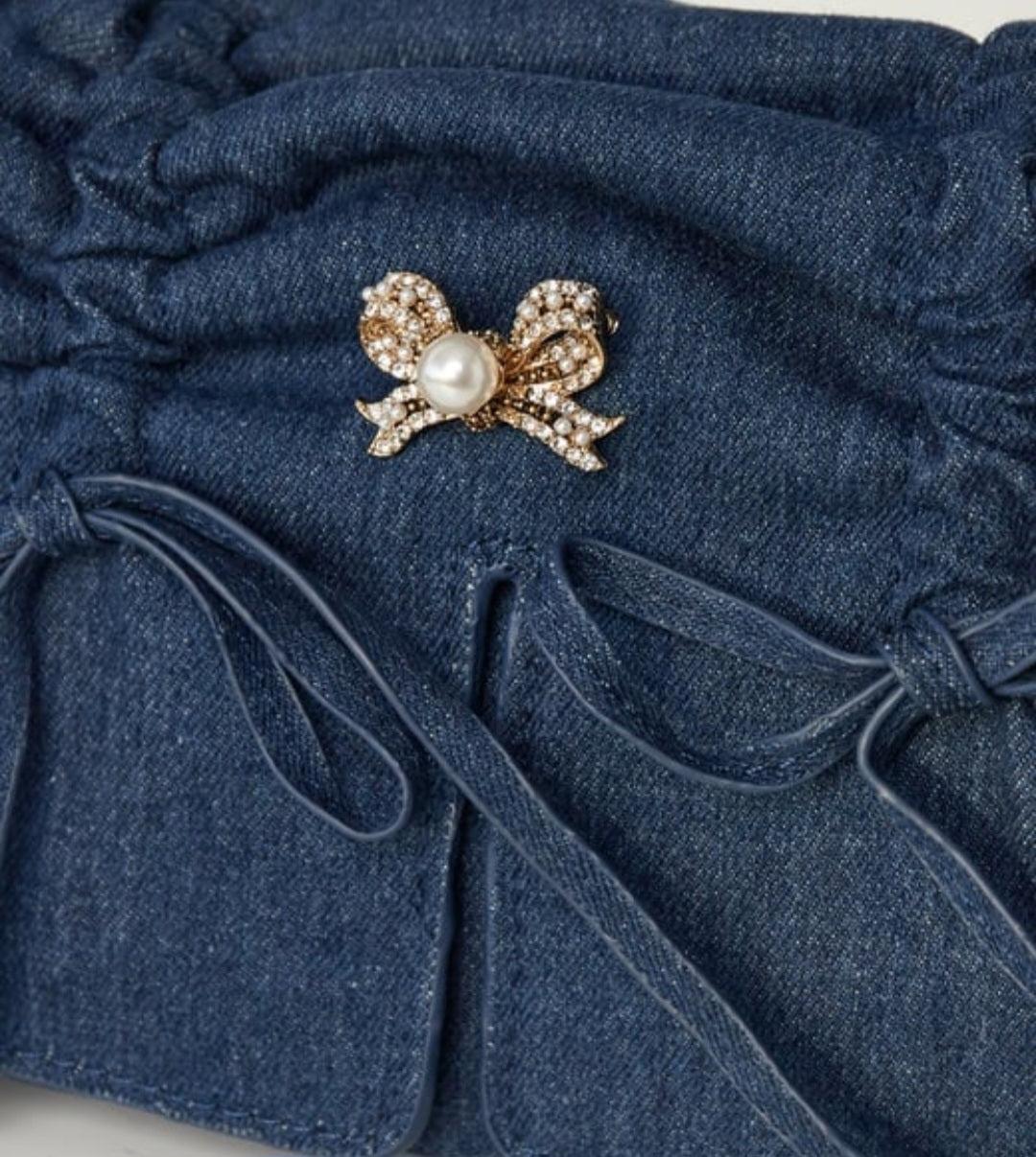 Broche strik met parel