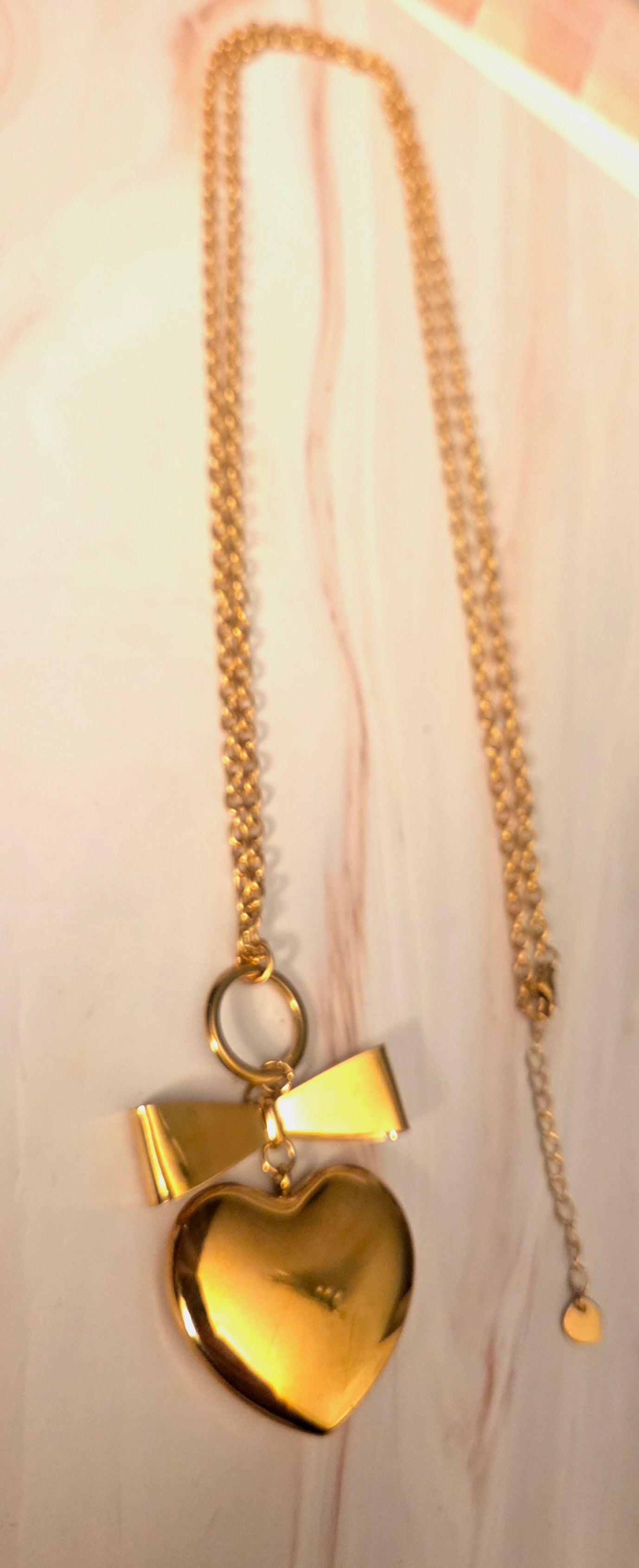 Lange ketting - 80cm - goud- met hart en strik- Stainlesssteel